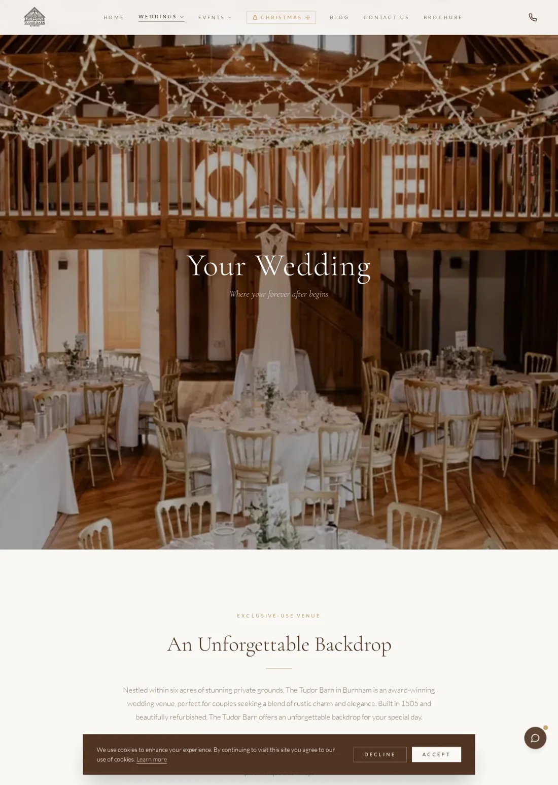 The Tudor Barn wedding page with a view of the decorated reception room